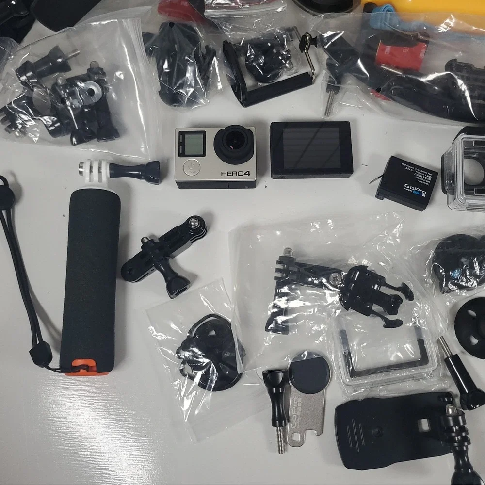 GoPro Hero4, Two Batteries, And Accessories Lot. Mounts, Body And Head Harness